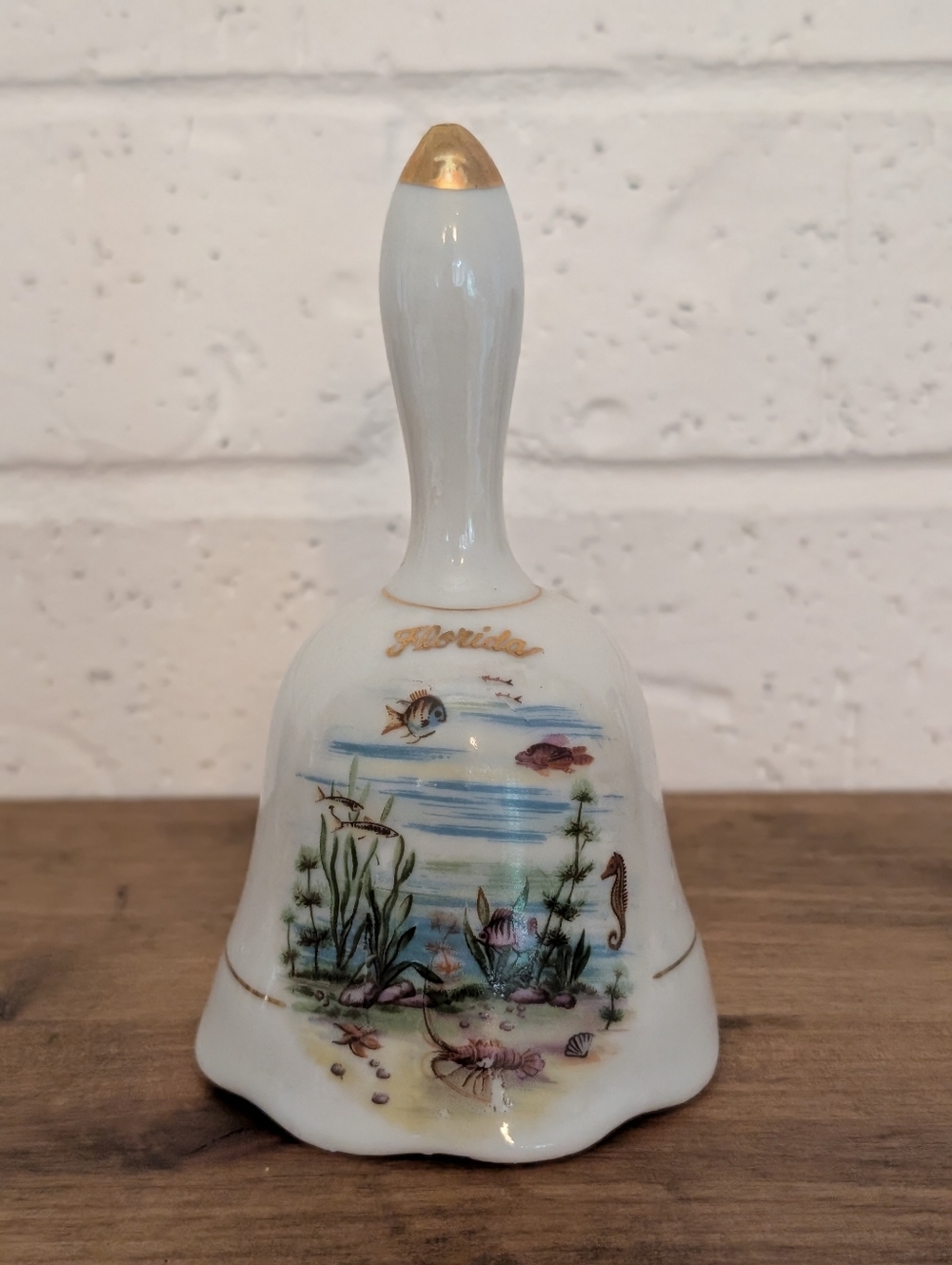 Vintage Florida Porcelain Nautical Hand‎ Bell with Gold Trim